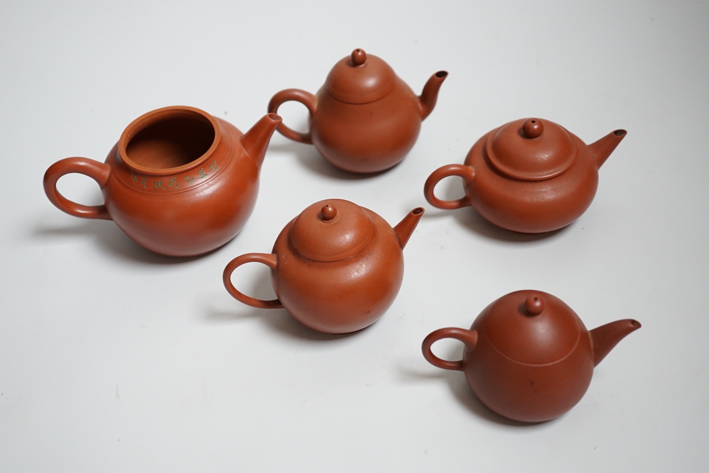 Five Chinese Yixing small teapots, probably 19th/20th century, one cover lacking
